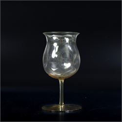 Four Arts and Crafts drinking glasses of dimple form, probably James Powell, Whitefriars, together with a dimple decanter, glasses H12cm