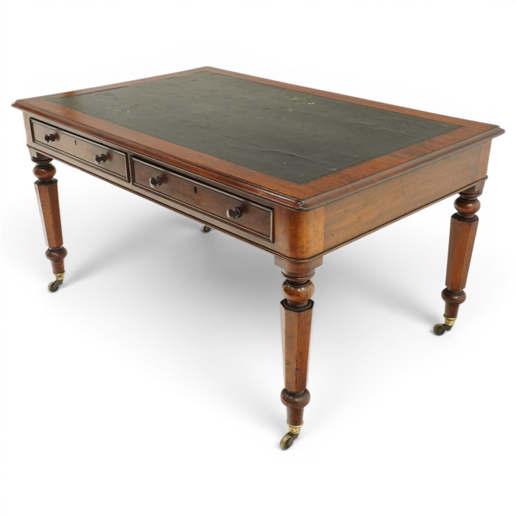 Mid Victorian four drawer mahogany partners' writing table, with leather inset top with moulded edge, with two frieze drawers to either side, on turned supports terminating in castors