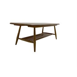 Ercol - elm and beech coffee table, rectangular top on splayed supports joined by undertier