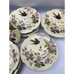 French hand painted dessert service, comprising two tazzas, four comports, and twelve plates, decorated with bird in flight amongst flowers