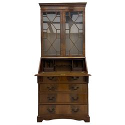 Reproduction mahogany bureau bookcase, the glazed bookcase over fall front bureau fitted with four drawers, on bracket feet