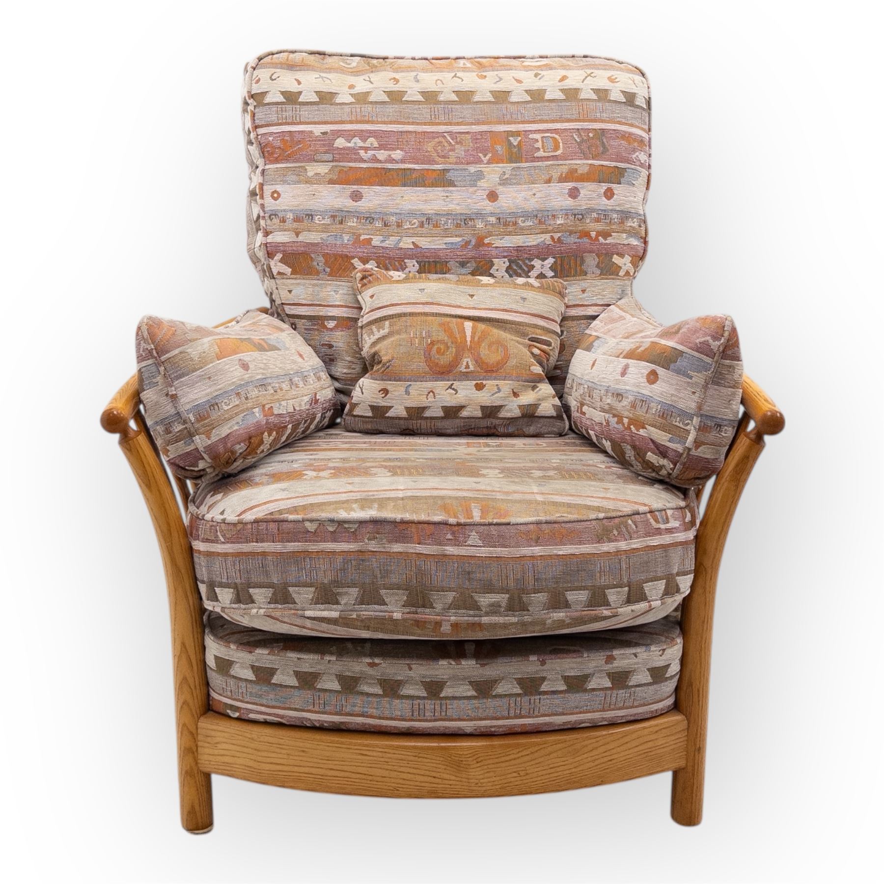 Ercol - Renaissance ash and elm high back armchair, upholstered in geometric Kilim patterned fabric with padded back, seat and arm cushions, curved stick back frame and turned supports