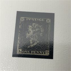 Great Britain Queen Victoria penny black stamp with black MX cancel and 1840 two pence blue stamp with black MX cancel, both housed in folders