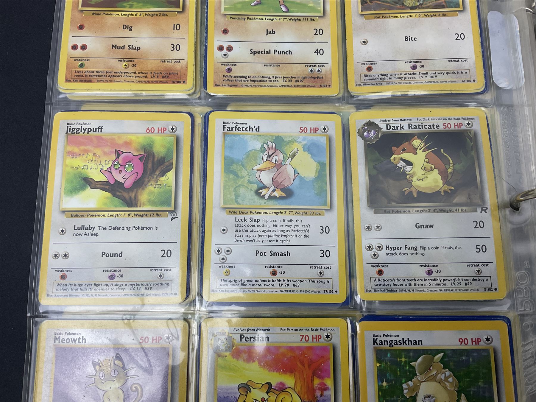 Collection of Pokemon trading cards, mostly 1999 Wizards Pokemon cards to include holo Charizard 4/102, first edition holo Machamp 8/102, further holographic cards; Dark Flareon 35/82 and Dark Vaporeon 45/82, cards from themed sets and 4th edition prints; 1998 Electronic Pokédex with cardboard boxes for themed decks Blackout, Overgrowth and Power Reserve Jungle, along with a large quantity of energy and trainer cards 