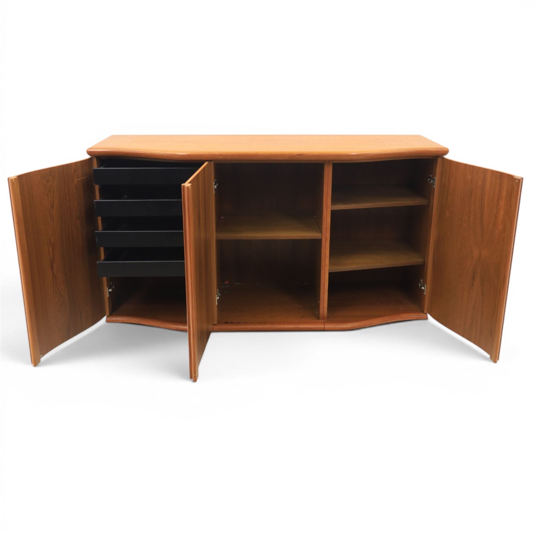 Skovby - model '400T' teak sideboard, shaped top above three cupboard doors with recessed handles, fitted with shelving and drawers