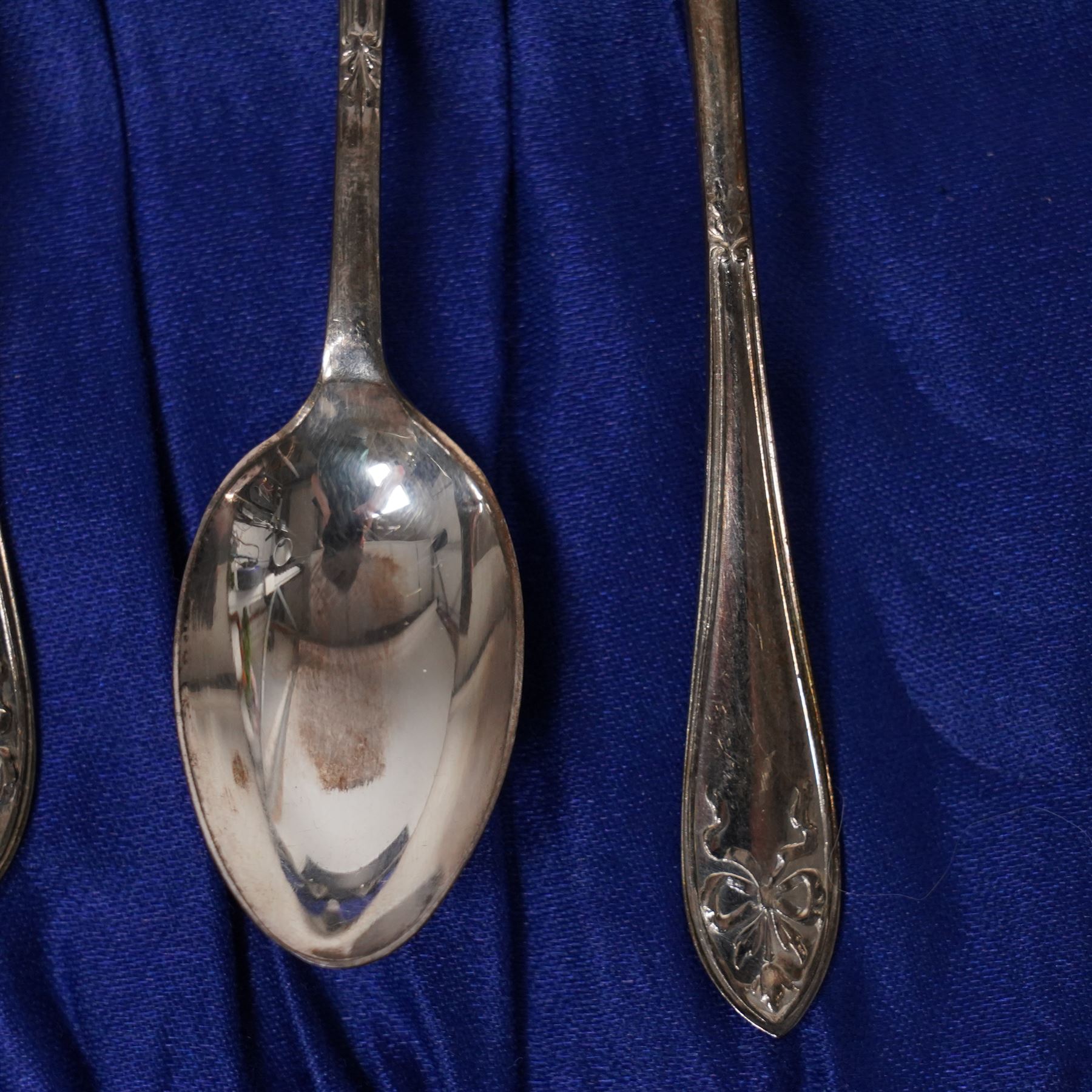Set of  of six silver coffee spoons and tongs with bright cut decoration Sheffield 1908 Maker Cooper Bros. and another set of six coffee spoons with decorative terminals
