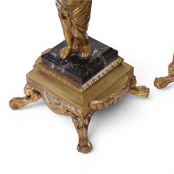 Pair of brass table lamps, the central column modeled as a putti upon a square marble base raised upon four claw feet, H29cm