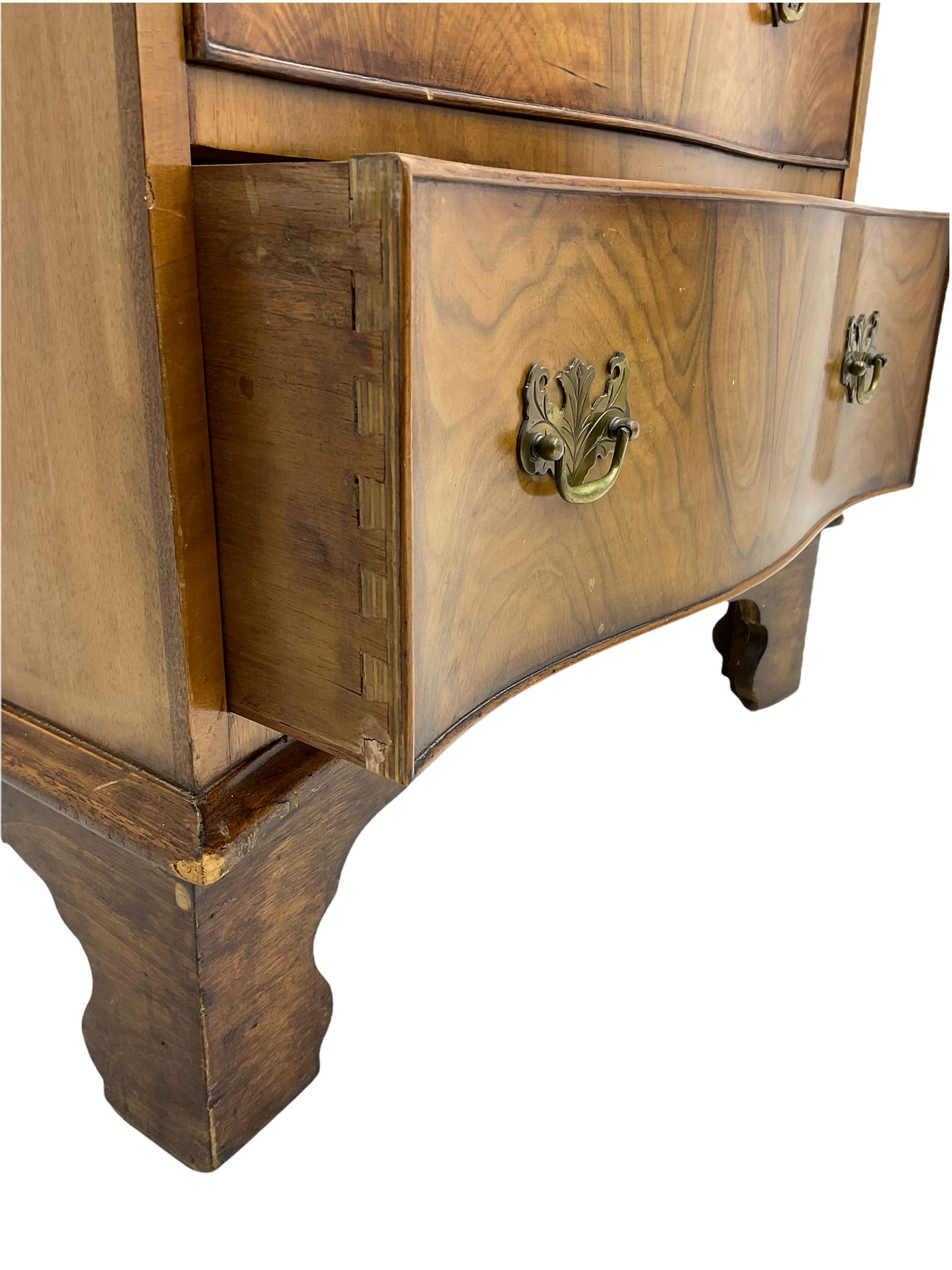 Burton Reproductions walnut chest on chest, fitted with six serpentine drawers