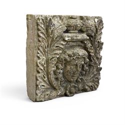 Weathered cast stone decorative wall panel, central female mask with urn motif surrounded by foliage