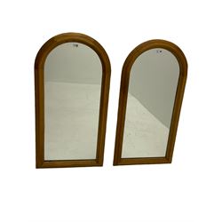 Pair arched top mirrors, in moulded oak frames (54cm x 107cm), and another oval mirror