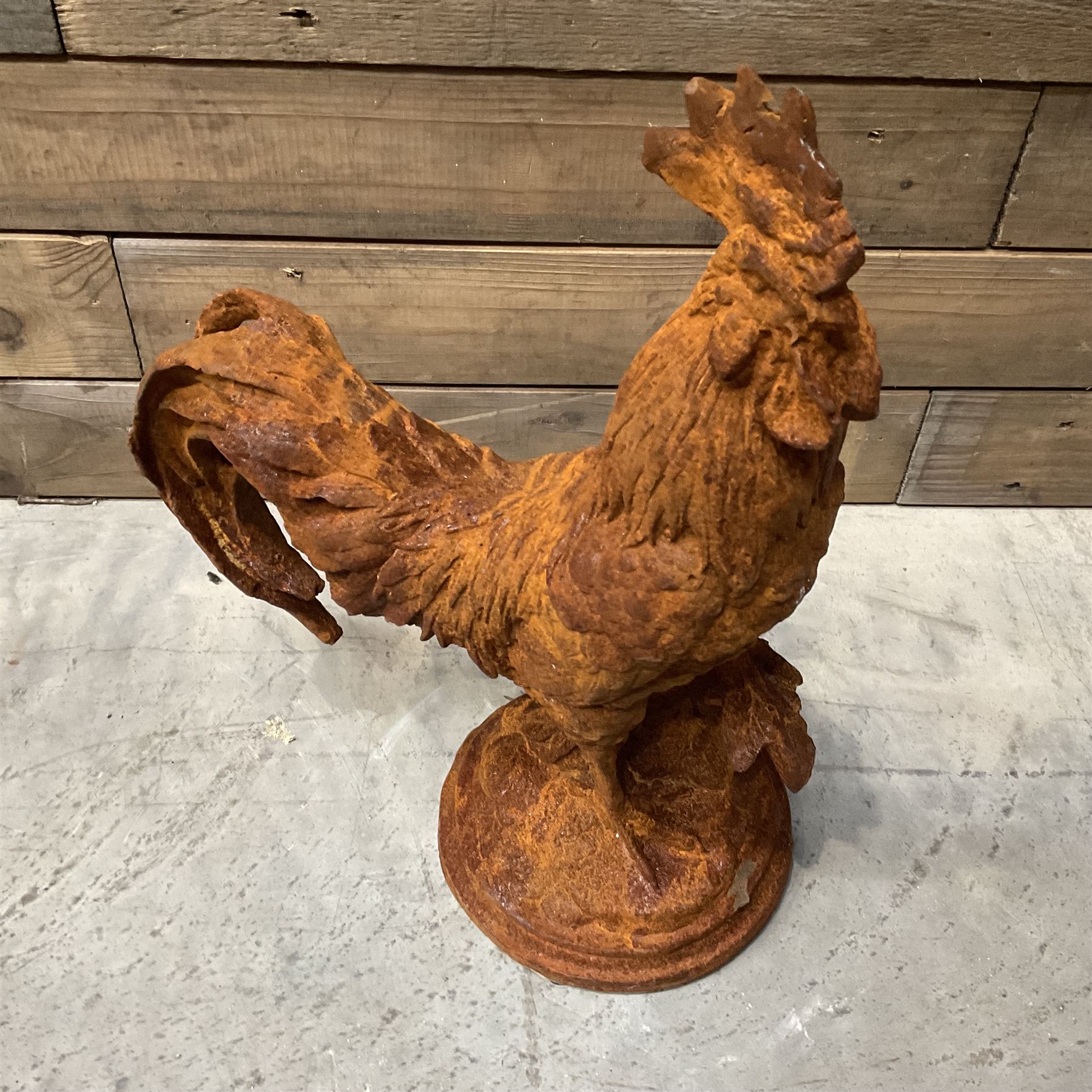 Small cast iron cockerell, on circular base