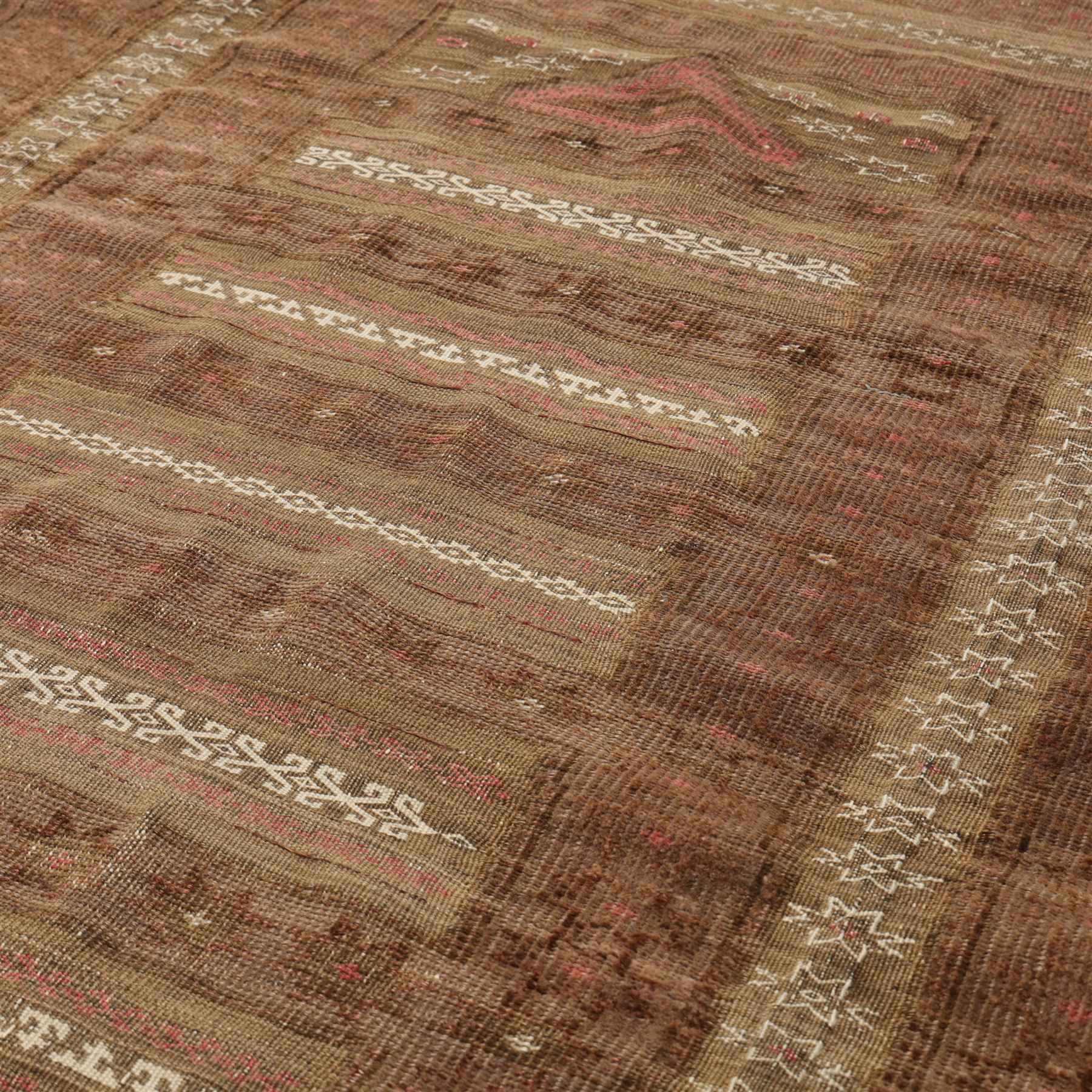 Tekke Turkman rug, madder red field decorated with repeating rows of octagonal guls, framed by multiple geometric borders, 86x133cm and an Anatolian flatweave kilim, 95x140cm, (2)