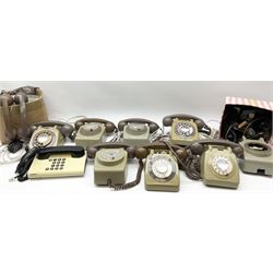 Collection of vintage telephones and spare parts including handsets.  