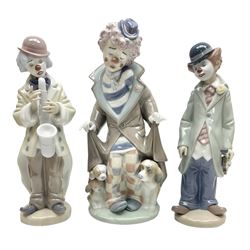 Three Lladro figures, comprising Sad Sax no 5471, Circus Sam no 5472 and Surprise 5901 