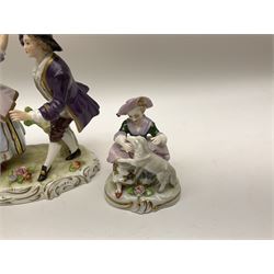 20th century Sitzendorf figure group, modelled as a male and female figure engaging in a dance, upon a naturalistically modelled base with encrusted flower detail and gilt scrolls to sides, H14cm, together with two smaller 20th century Sitzendorf figures, modelled as a shepherd and shepherdess, each with mark beneath. (3).