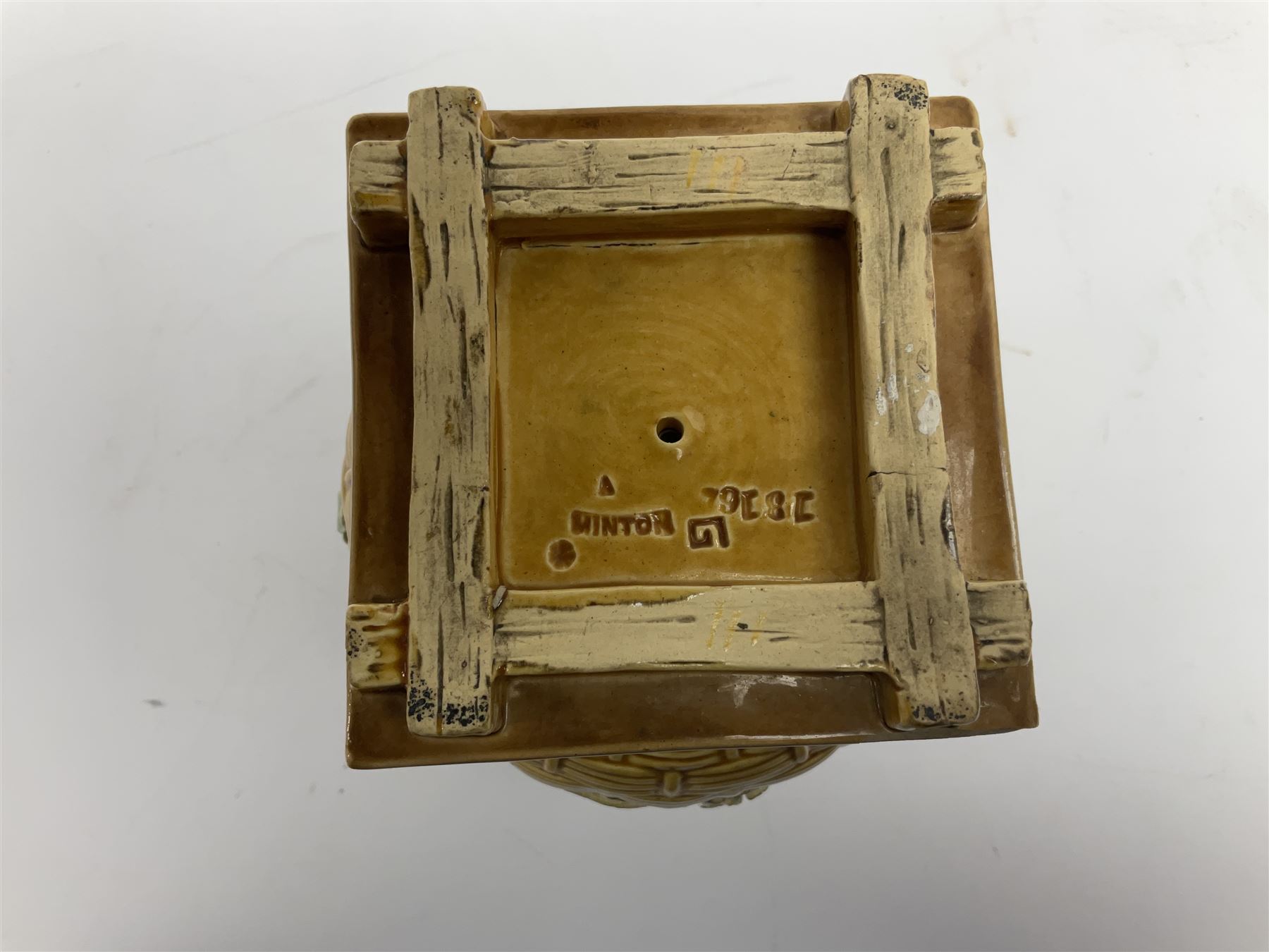 Minton majolica vase, the squat body with twin handles, with part osier moulding and applied Spring flowers against a cobalt blue ground, upon integral square base, impressed beneath Minton 1316, H16.5cm