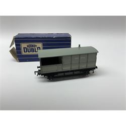 Hornby Dublo - twenty wagons including Cattle Trucks; Low-Sided Wagons; Cable Drum Wagons; Tank Wagons for Shell Lubricating Oil; Mineral Wagons; 20-Ton Bulk Grain Wagons; Goods Brake Vans; Furniture Containers etc; all in blue striped boxes (20)