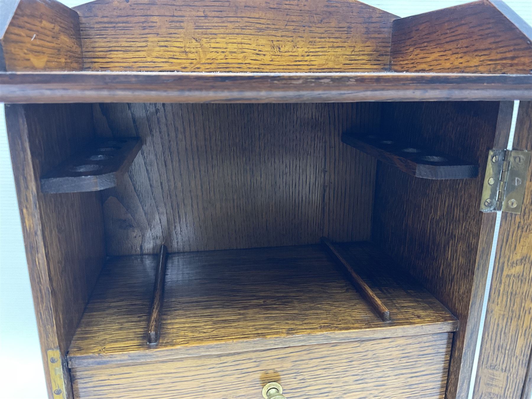 Edwardian oak smokers cabinet with the single glazed door to fitted interior having a single draw and pipe rack, H40cm