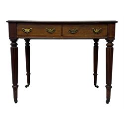 Early 19th century mahogany side table, moulded rectangular top over two drawers, on turned and reeded supports, brass cups and castors 