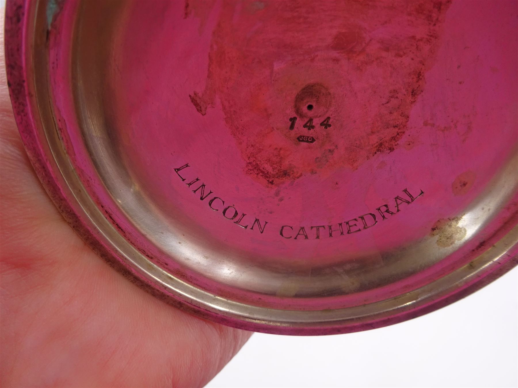 Modern limited edition silver goblet, a replica of the original silver chalice of Lincoln Cathedral, with hand planished decoration, and engraved band of laurel leaves to bowl, with gilt interior, upon waisted stem and circular stepped foot, no. 144/200, hallmarked John Cussell, London 1977, H15cm