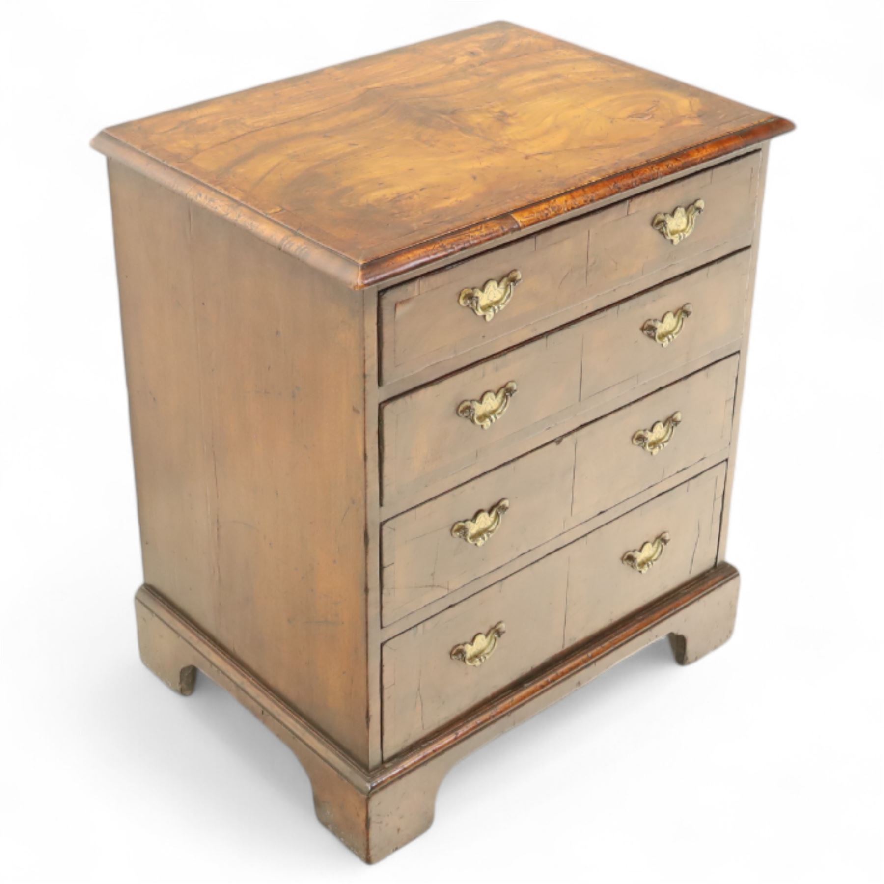 Small 19th century figured walnut chest of drawers, rectangular top with moulded edge over four graduating drawers with brass batwing handles, raised on bracket feet