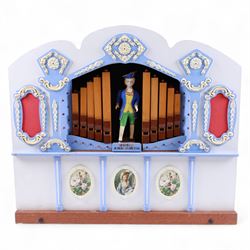 John Smith-20th century hand cranked portable street organ “music and mirth” in a wooden case with carrying handles, with speaking pipes and mannequin to the front. All pipes present, however the mechanism is in need of restoration. With five paper music rolls.