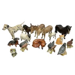 Group of Beswick figures, to include Woolly Shetland mare pony, no 1033, fox modelled in recumbent pose by Arthur Gredington, no 1017, two donkeys, dapple grey foal, John Beswick ginger Tom cat, Dalmatian dog, sheep, dachshund, five birds etc