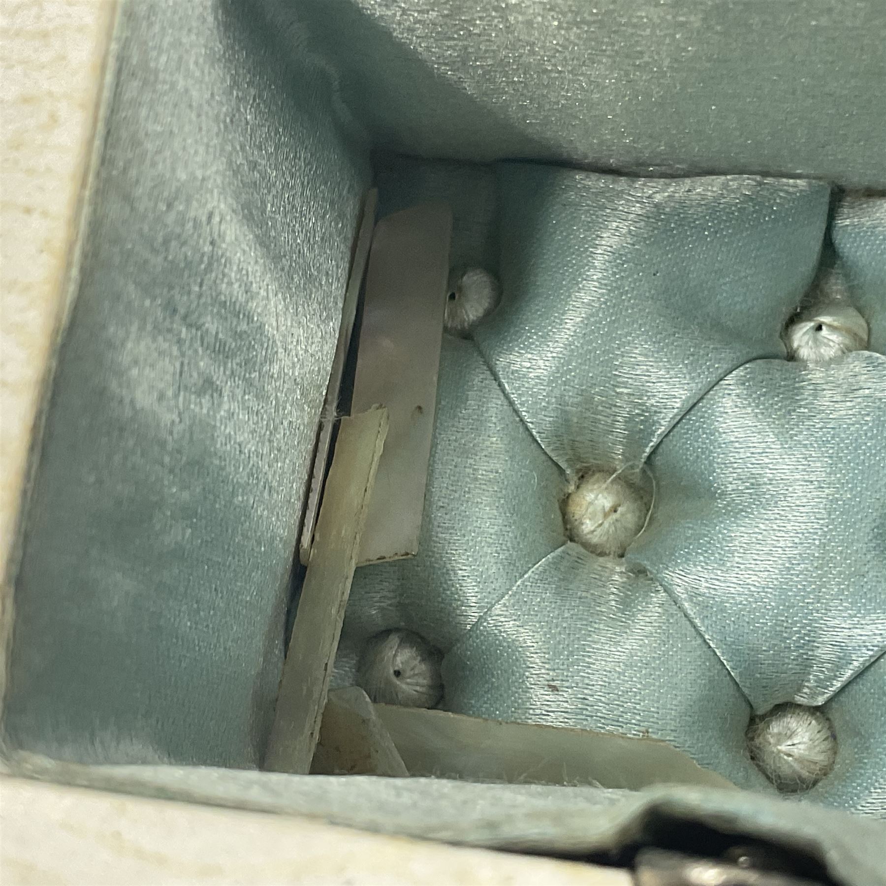 19th century French souvenir jewellery casket in the form of a bathing machine, having mother of pearl panelled tiled effect body, hinged roof/cover revealing a blue silk fitted interior with cushioned base, two silvered metal wheels, abalone shell door and mother of pearl steps, inscribed 'Berck Plage' in blue, H12cm, W13cm 