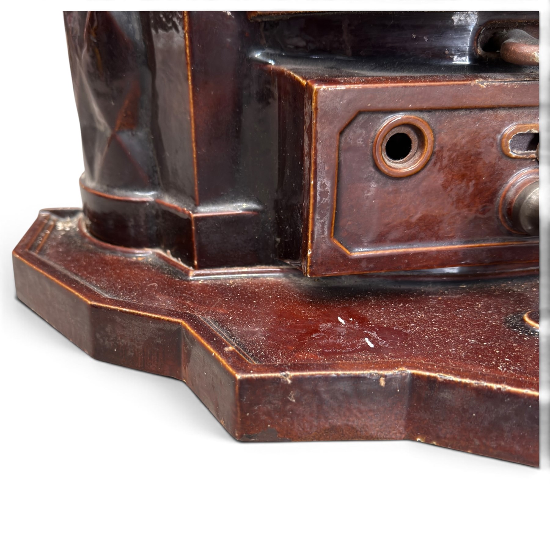 Deville & Cie of Charleville - early 20th century Art Deco cast iron and burgundy enamel 'Cristal' wood burning stove, hinged vent over lattice glazed door and ash drawer, on shaped geometric base, circa 1920