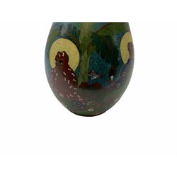 Japanese Cloisonne vase, Meiji/Taisho period, decorated with five haloed figures, possibly the Lucky Gods or Monks, in a landscape detailed with pine trees, lotus flowers and auspicious clouds, beneath a neck with band of fronds, with apocryphal Ming mark beneath, H31cm