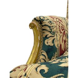 William Bertram & Son of London - pair late 19th century giltwood armchairs, moulded frame with scroll carved back and arm terminals, upholstered in striped fabric with foliate pattern, on shell carved cabriole supports, the brass castors stamped 