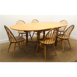  Ercol light elm oval extending dining table, turned supports, 'X' framed stretchers W213cm, H73cm, D108cm) and set six hoop back dining chairs (W43cm)  