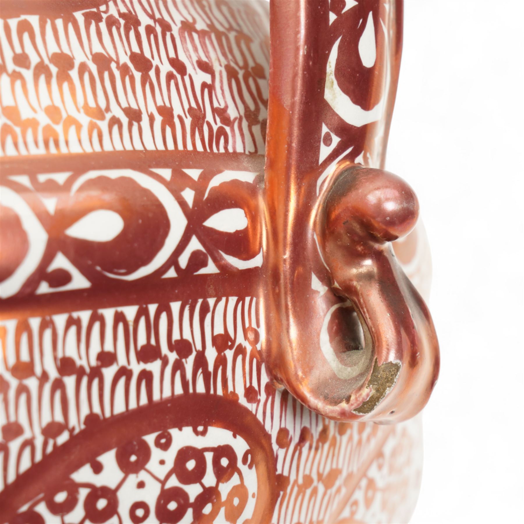 Hispano-Moresque copper four-handled lustre vase, decorated with repeating leaf and foliate patterns, H30cm 
