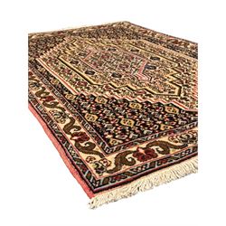 Small Persian Bidjar rug, the field decorated with floral Herati motifs, within floral design borders and guard stipes 