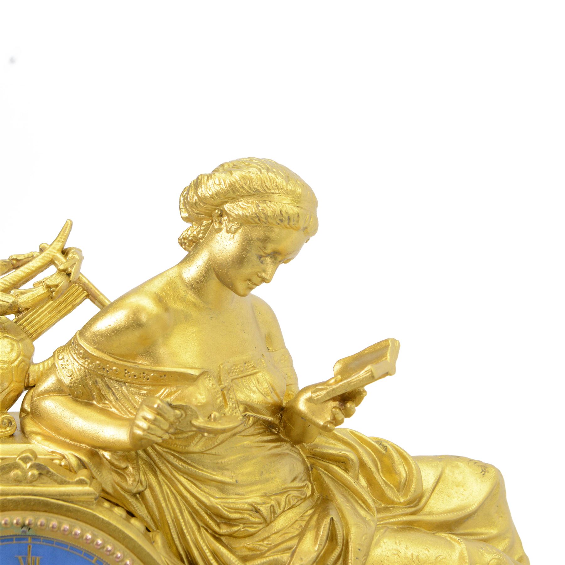 French- Napoleon III porcelain inset 8-day figural clock in a gilt case c1870, drum housed movement resting on a rectangular plinth with light blue porcelain panels each painted with different classical images and depictions from antiquity, conforming dial with a garland of flowers to the centre, gilt Roman numerals, minute track and brass spade hands, with a seated figure of a classical maiden reading a book, mounted on a matching gesso base with a velvet padded top, Parisian countwheel striking twin train movement, striking the hours and half hours on a bell. With a contemporary ebonised base and oval glass dome. With pendulum.

