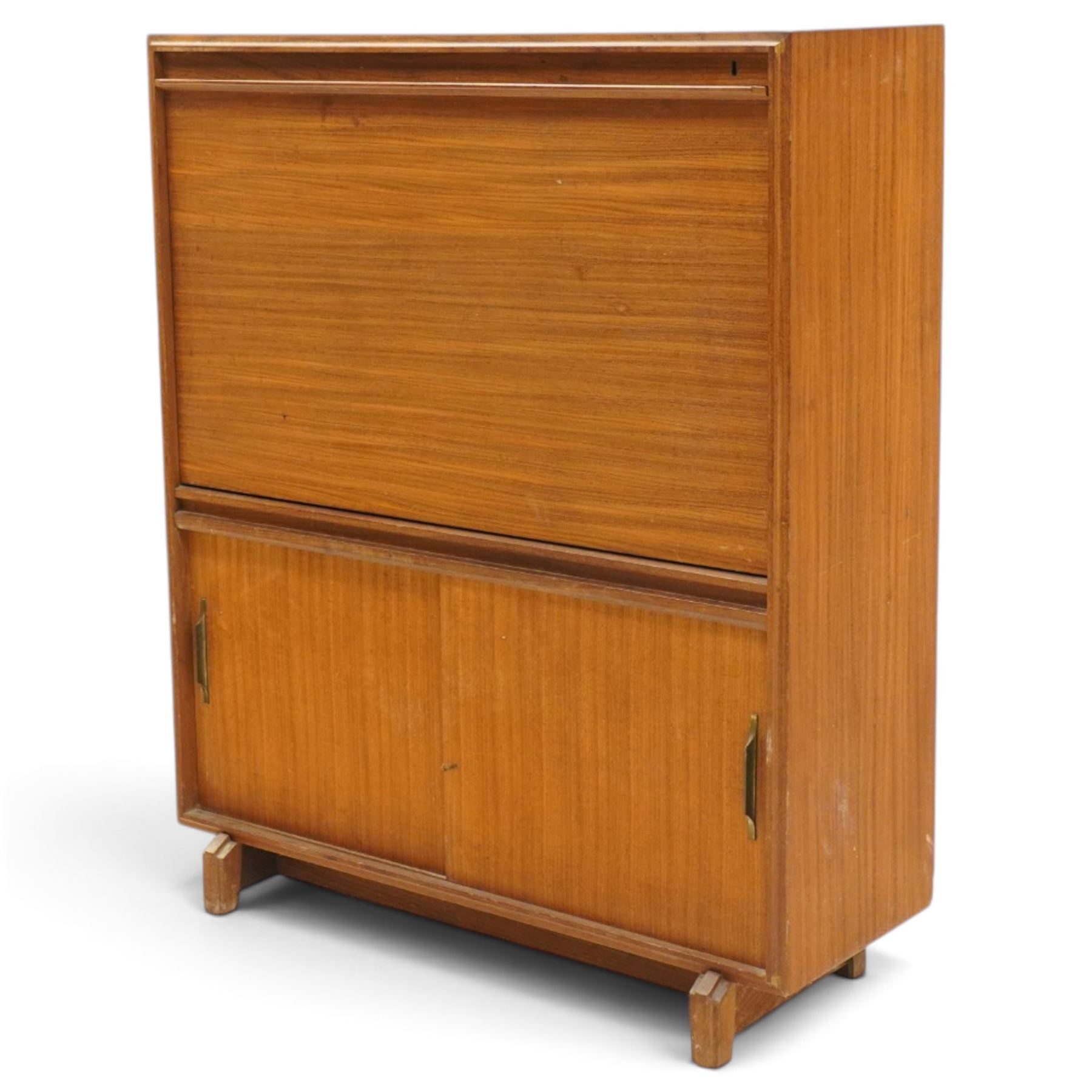 Robert Heritage (1927-2008) for Beaver & Tapley - Mid 20th century teak bureau, fall front with fitted interior, above a sliding door cabinet, raised on short supports