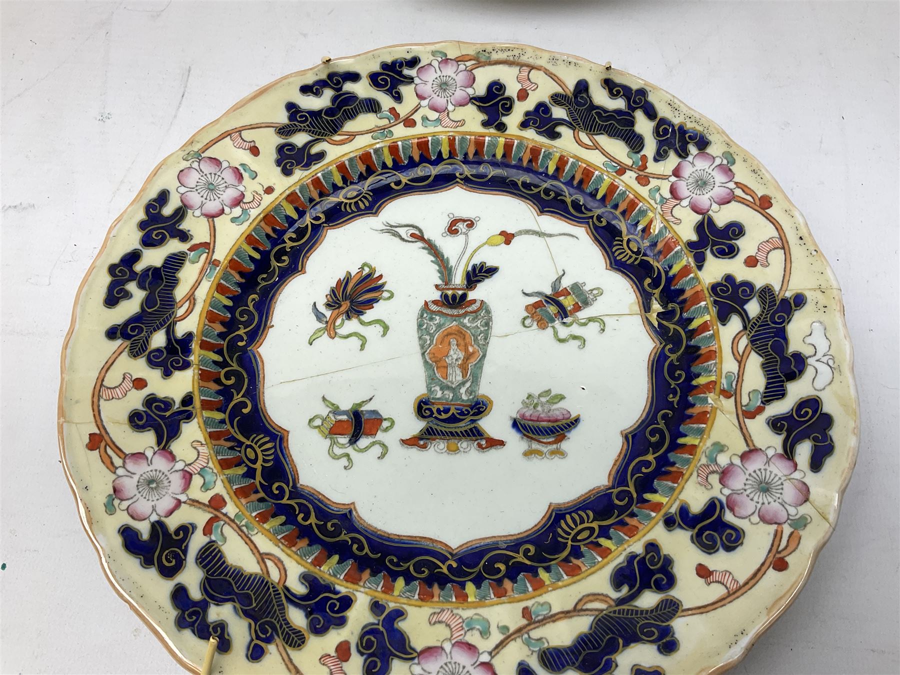 Four mid 19th century Mason's Ironstone plates decorated in the Chinese Antiquities pattern, the central circular panel decorated with footed vase with stylised motifs within a floral border, with gilt detail, pattern no. 1438, largest D26cm, together with Royal Worcester plate with floral decoration within green borders, blue and white tankard with pewter lid and teapot, teapot
