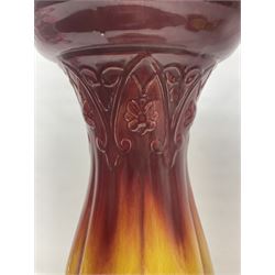 Bretby Jardiniere and stand, with foliate and foliage decoration with a red and yellow ground, impressed mark beneath H94cm