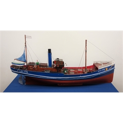  Large wooden scale model of the Steam fishing Trawler 'Joseph & Sarah Miles' LO.175, L120cm, W28cm, H48cm, Built in 1895 the Joseph & Sarah Miles was a Mission Shjp which as part of a Fleet would not fish on a Sunday to enable any Religious crew to attend service. On 12th October 1904 the Gamecock Fleet was fishing Dogger Bank when the Russian Baltic Fleet mistook them for the Japanese Navy and Fired on them. The S.T.Crane was sunk, the injured and survivors were transferred to Joseph & Sarah Miles.   