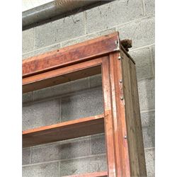 Large pitch pine library bookcase, early 20th century, the top fitted with six doors enclosing six shelves, above six panelled doors to base, for restoration. Splits in four for transportation.  H285cm, L426cm, D49cm - COLLECTION BY APPOINTMENT FROM: The White House, Thirsk Road, Easingwold, York, YO61 3NF - CALL 01723 507111 TO ARRANGE