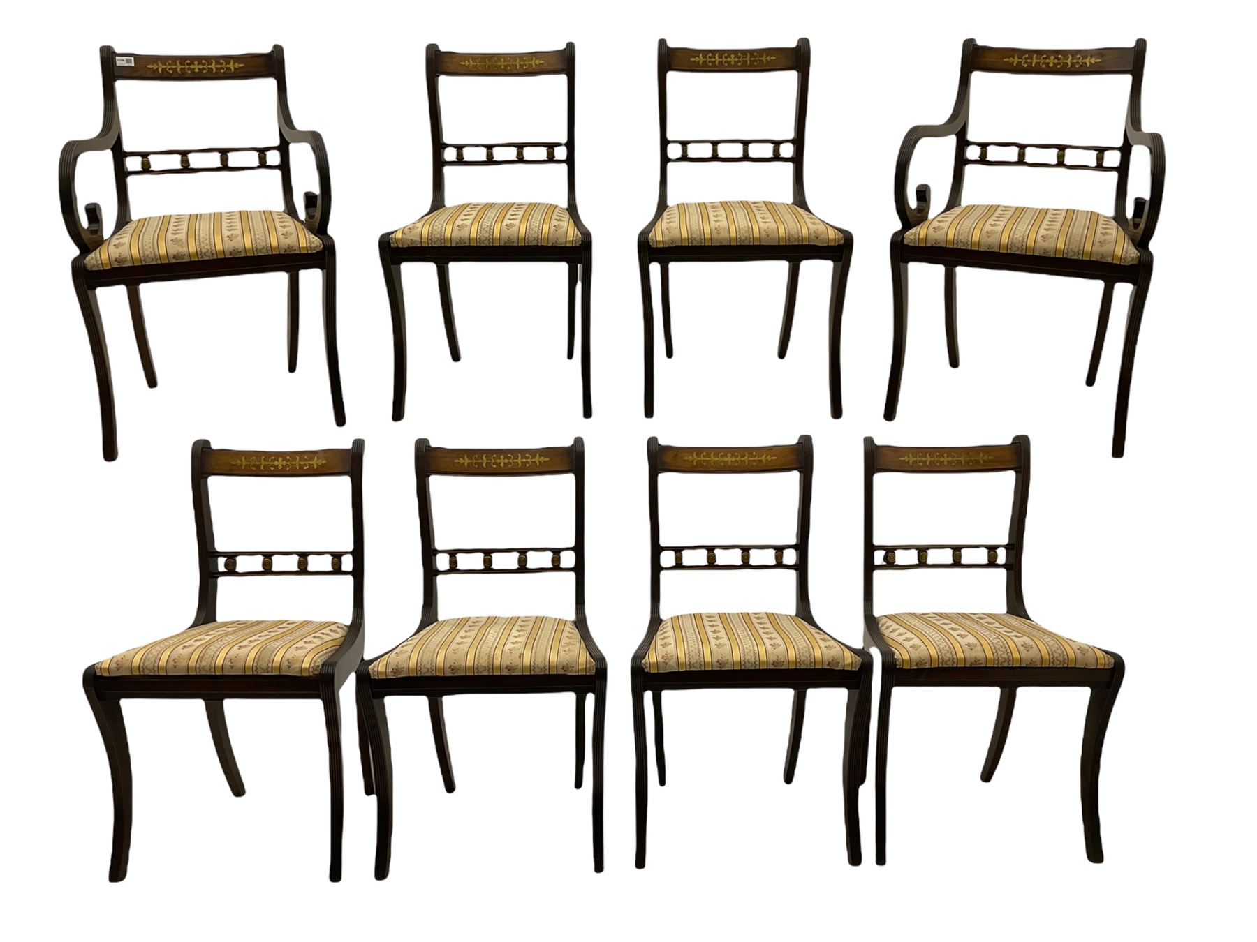 Set of eight Regency style mahogany dining chairs, brass inlay with gilded detail