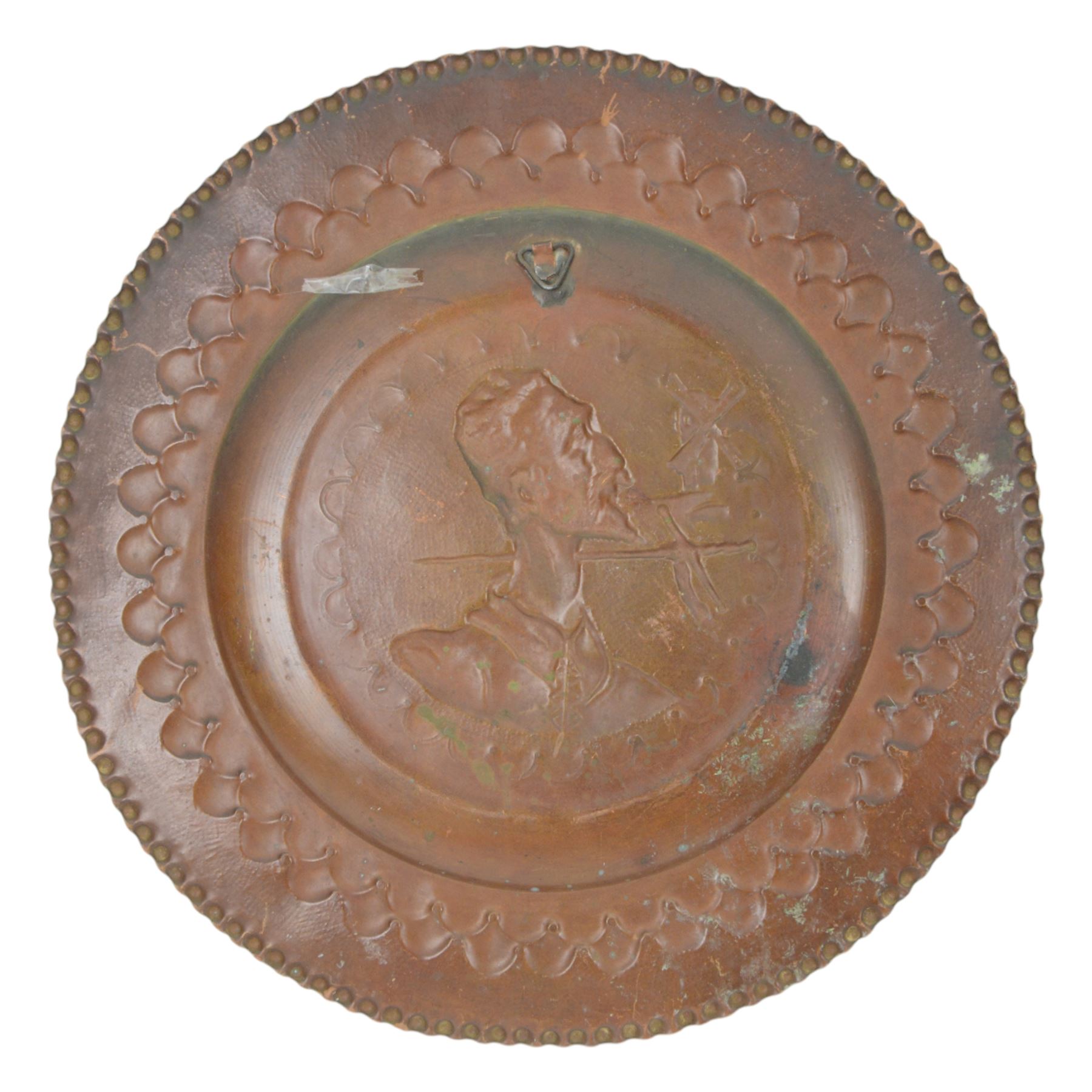 Two Spanish copper  charger decorated with Don Quixote, together with another copper dish  