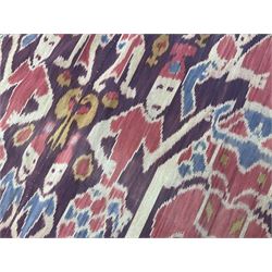 Ikat Man’s Cloth (Hinggi Kombu), East Sumba, Indonesia, woven in red, blue and yellow-brown warp ikat, constructed of two mirroring long panels, the motifs arranged in four bands depicting warrior figures astride rearing horses, high-ranking figures and guardians within geometric borders, on carved wooden wall hanger, L295cm
