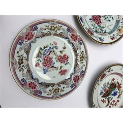 Three 18th century Chinese plates, decorated in the famille rose pallet with various motifs including peonies, prunus blossom, butterflies and phoenix, each approximately D23cm