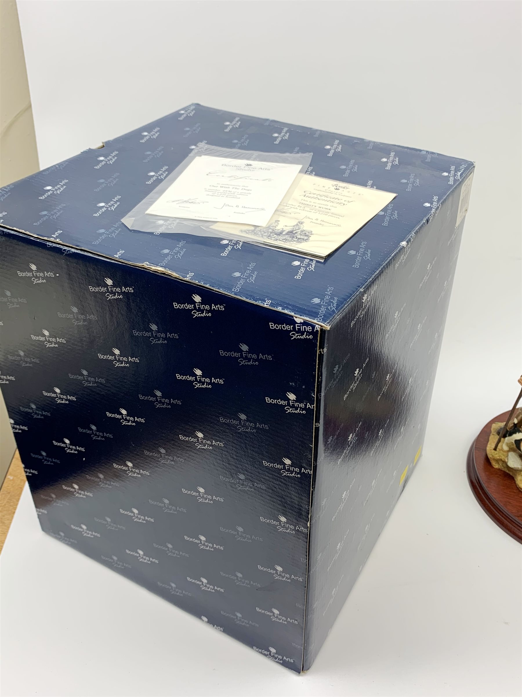 Two limited edition Border Fine Arts figure groups, comprising Out with the Dogs, model no A2647 by Craig Harding, 534/1250, on wooden base, figure H25cm, with accompanying certificate and box, and Thirsty Work, model no B0740 by Craig Harding, 615/1250, on wooden base, figure H21cm, with accompanying certificate. 