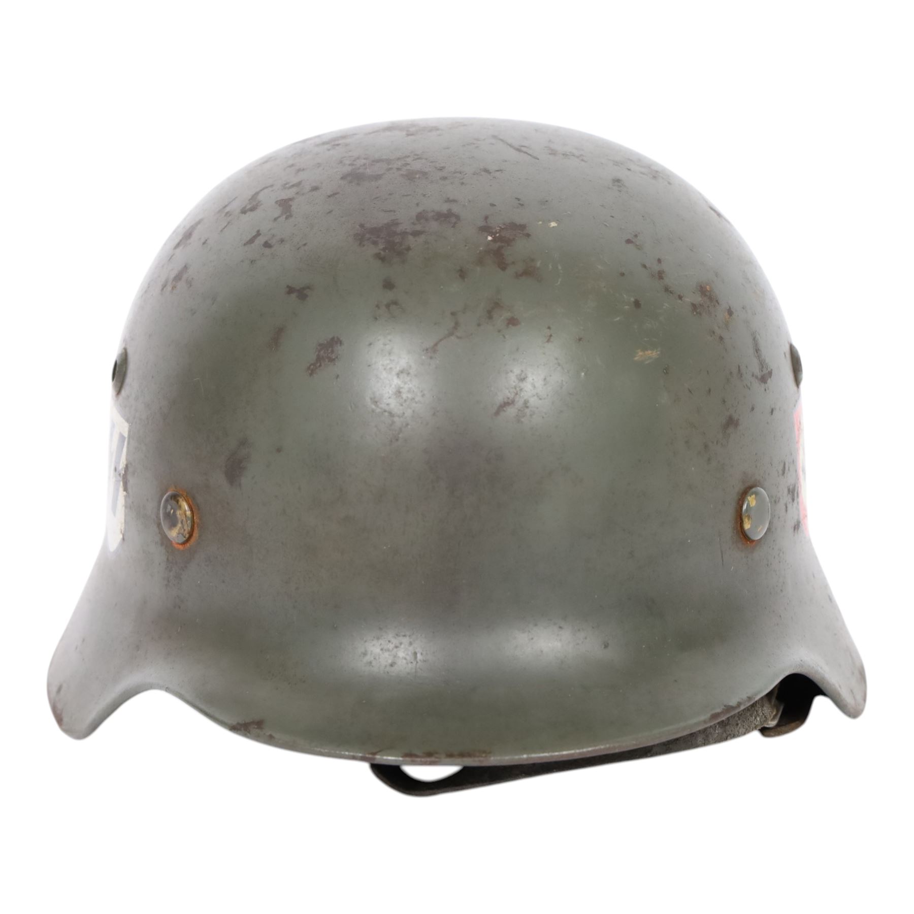 German Third Reich Waffen-SS M35 double decal helmet, the left inner brim stamped SF64, the back inner brim stamped 3866, with leather eight tongue liner and chinstrap