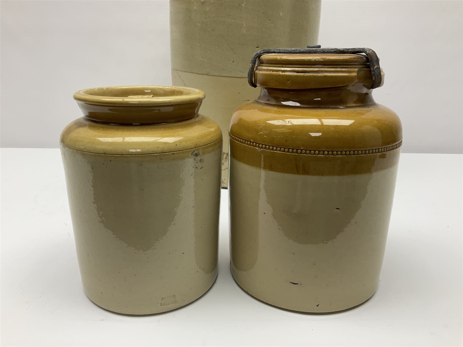 Large 2 gallon stoneware flagon, stamped 'John Soulby Wine Merchant Malton 2 Gall', together with a collection of similar stoneware jars and bottles, largest H40.5cm