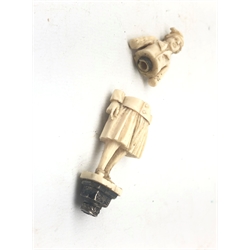  19th century ivory novelty needle or bodkin case carved as a Dutch figure of a man in a cap, on a white metal seal pedestal base H8cm   