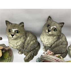 Two Royal Doulton cats, two Capodimonte style figures, and four ceramic baskets of flowers 