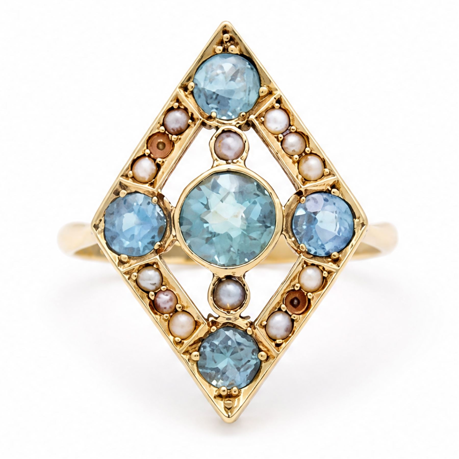 Early 20th century gold blue stone and split pearl diamond shaped ring, five milgrain set round cut stones possibly zircon or aquamarines, with seed pearl surround in a pierced design setting, stamped 18ct 